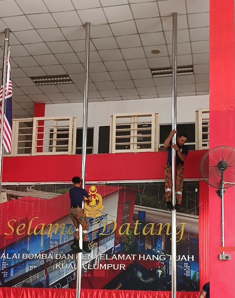 fireman-going-down-fire-pole-hang-tuah-fire-station-kl